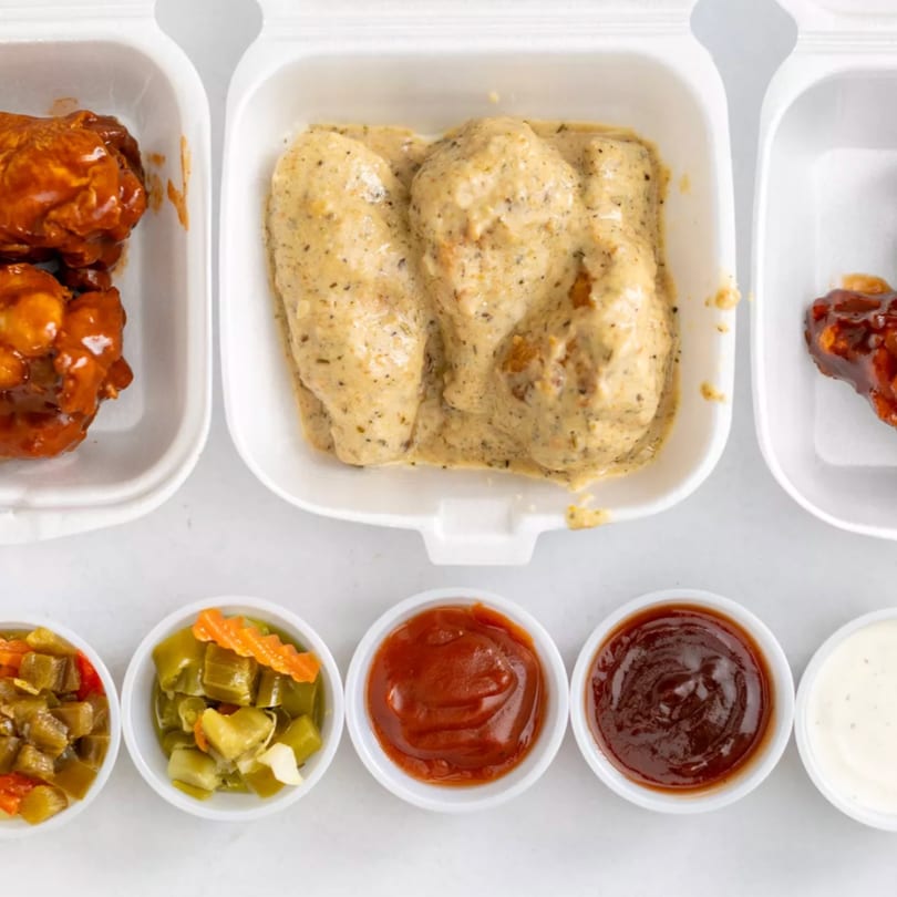 Centralia's Chicken & Fish Italian Beef fried chicken wings in three containers with five dipping sauces.